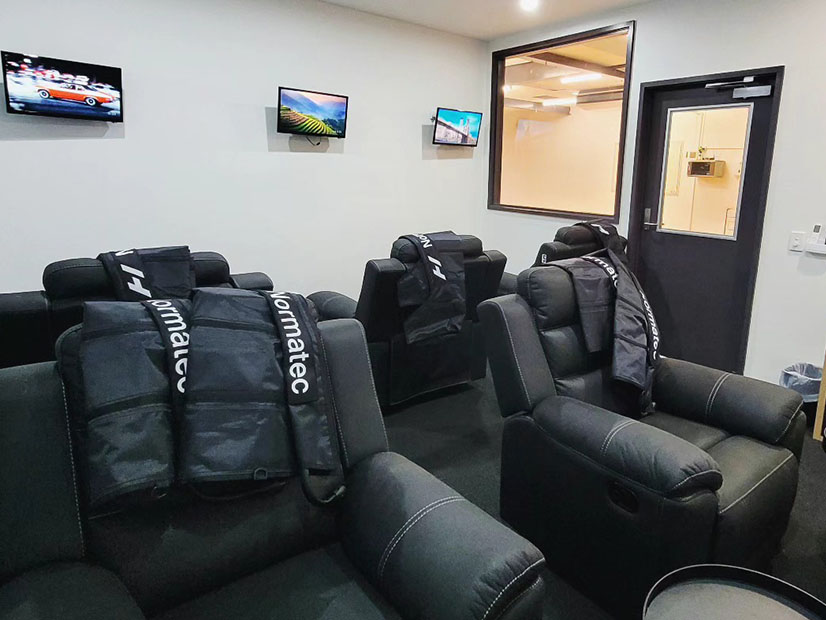 Macleod recovery lounge room with Normatec Compression boots